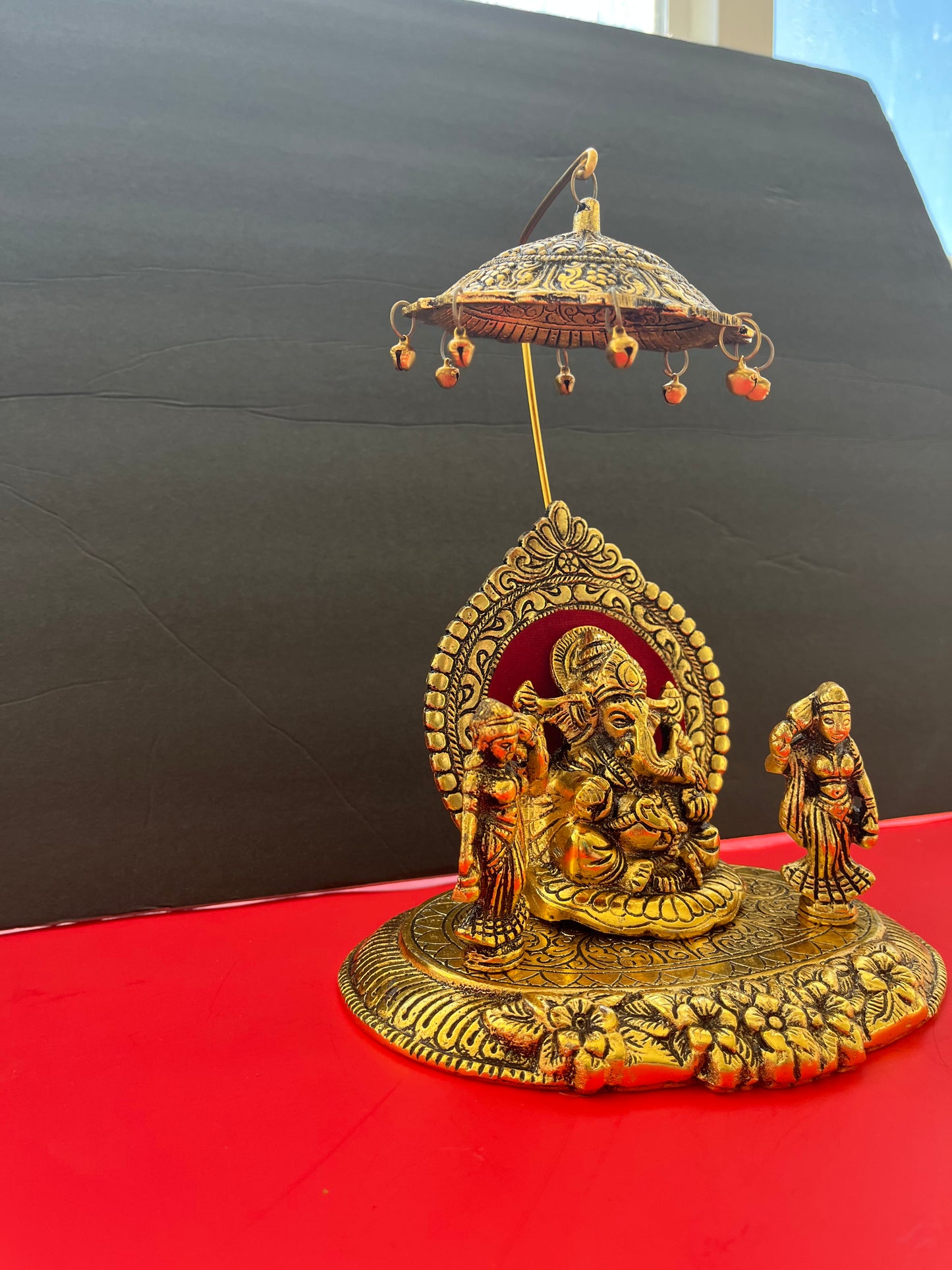 Oxidised Metal Sitting Lord Ganesh Under Umbrella with Goddess Ridhi and Sidhi Showpiece