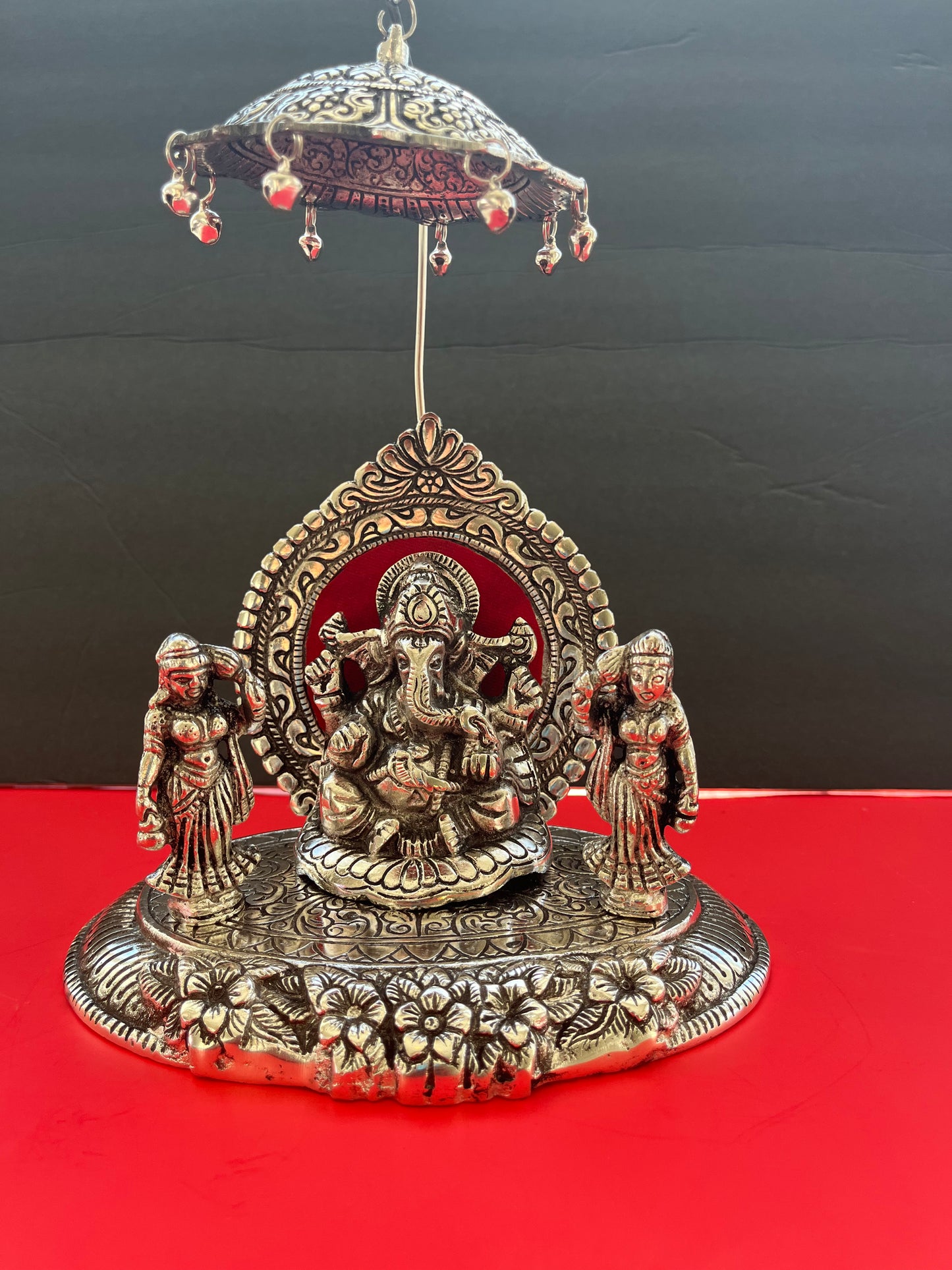 Oxidised Metal Sitting Lord Ganesh Under Umbrella with Goddess Ridhi and Sidhi Showpiece